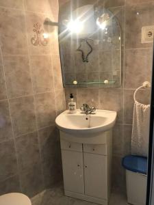 a bathroom with a sink and a mirror at Panoramic Sea Views in Calpe