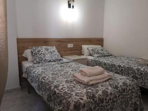 two beds in a small room at Panoramic Sea Views in Calpe +32 photos