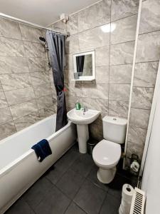a bathroom with a toilet and a sink at Hs UK Homes Beautiful 2 bed in Bradford in Bradford