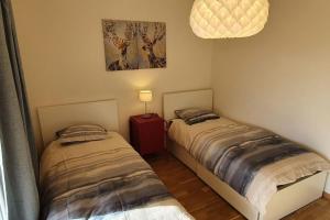 Postel nebo postele na pokoji v ubytování Apartment via San Carlo in Muralto-Locarno