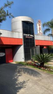 a tesla store with a sign on the side of it at MOTEL 2000 in Sao Paulo
