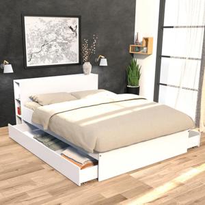 a bedroom with a white bed with white drawers at Studio très calme en plein centre ville entrée indépendante in Lunel