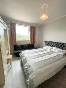 A bed or beds in a room at Quiet self-catering holiday home with surrounding lakes