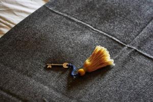 a yellow comb and a yellow tuft of hair on a jacket at Dawn at The Sun Inn Felmersham, Our Signature Duplex Suite in Sharnbrook
