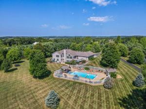 an aerial view of a large house with a swimming pool at Country Oasis 