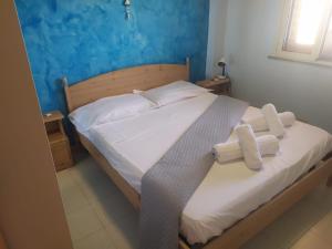 A bed or beds in a room at Casa Terrasini