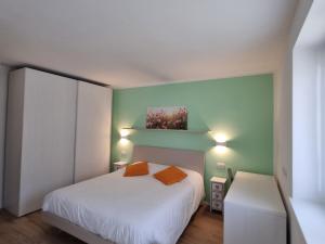 LaLunaMia B&B and Holiday Apartment tesisinde bir odada yatak veya yataklar