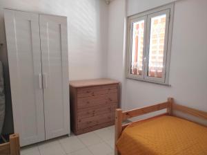 A bed or beds in a room at Casa Terrasini