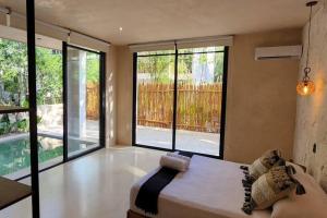 Llit o llits en una habitació de Apartment with private pool Tulum