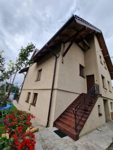 a building with a staircase in front of it at Apartment Oliver in Ujazd