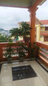 a balcony with potted plants on a building at Nhà nghỉ Thiện Trang in Kiến An