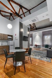 a living room with a table and chairs at Costello Hotels Port Augusta in Port Augusta