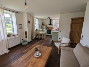 a living room with a couch and a table at Alter Kornspeicher im Münsterland in Greven