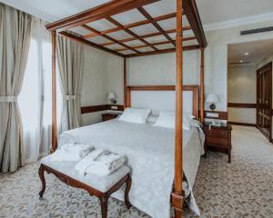 Postel nebo postele na pokoji v ubytování Hotel Cándido