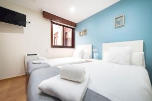 Giường trong phòng chung tại Apartamento Las Candelas, Ares