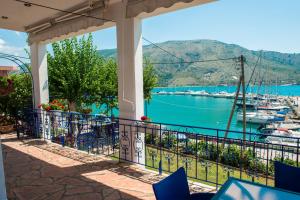 a balcony with a view of a marina at Villa Rosanna in Plataria