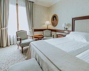 Postel nebo postele na pokoji v ubytování Hotel Cándido