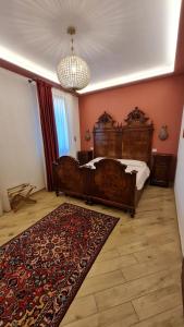 a bedroom with a large bed and a rug at B&B Corte dei Ducati in Comacchio