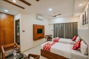 Ένα ή περισσότερα κρεβάτια σε δωμάτιο στο Saavees Residency