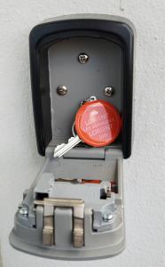 a metal box with a red disc in it at Ile du Ponant in Ploemeur +7 photos