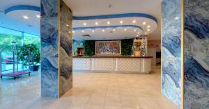 a lobby with a bar in a building at SPA Hotel Sirius Beach - FREE SPA access in St. St. Constantine and Helena +69 photos