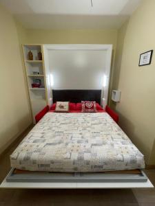 a bedroom with a large bed in a room at Monolocale piccolo ed accogliente - CIR 0021 - in Aosta