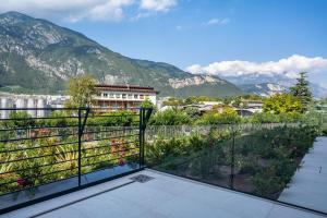 a balcony with a view of the mountains at Appartamento Midum Garden Nord in Trento