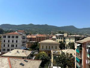 a view of a city with mountains in the background at Notti magiche a Santa Margherita ligure in Santa Margherita Ligure
