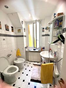 a bathroom with a toilet and a sink at Notti magiche a Santa Margherita ligure in Santa Margherita Ligure