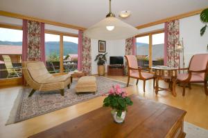 a living room with chairs and a table at Residenz Sonnwinkl in Reit im Winkl
