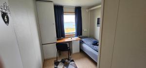 Postel nebo postele na pokoji v ubytování Gamvik brakkebo as
