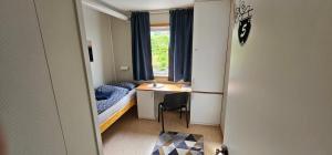 Postel nebo postele na pokoji v ubytování Gamvik brakkebo as