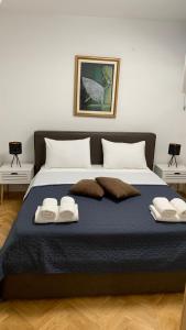 Ένα ή περισσότερα κρεβάτια σε δωμάτιο στο MM Split apartment - 5 min by car to the beach & city center - free public parking