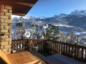 a balcony with a view of snow covered mountains at Le Tremplin in Barcelonnette