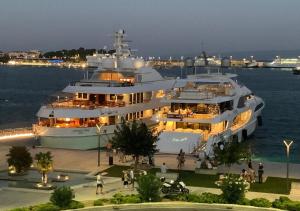 a large yacht parked in the water at night at Apartment Mila in Split