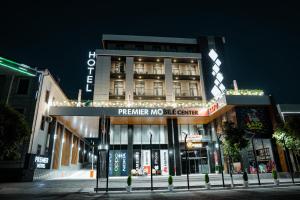 a building with a sign that reads prepare noale centre at PREMIER HOTEL in Andijan