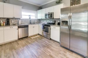 a kitchen with white cabinets and stainless steel appliances at Serene Kings Mountain Home Near 2 Kings Casino! in Kings Mountain