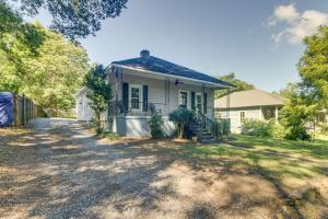 a white house with a porch and a driveway at Serene Kings Mountain Home Near 2 Kings Casino! in Kings Mountain