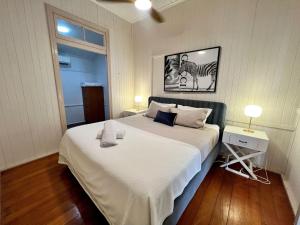 a bedroom with a bed and a picture of a zebra at Sturges Street 22 - Unit 1 in Aitkenvale