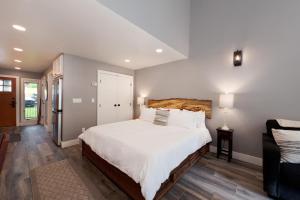 a bedroom with a large bed with white sheets at Tamarron HighPoint - 571 in Durango