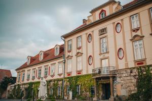 a large building with clocks on the side of it at Stará střelnice Hranice in Hranice