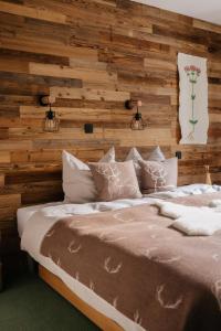 Postel nebo postele na pokoji v ubytování Eko hiša-Eco House Na razpotju