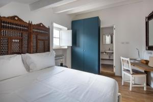 Ένα ή περισσότερα κρεβάτια σε δωμάτιο στο Casa Azul alla Cala by Wonderful Italy