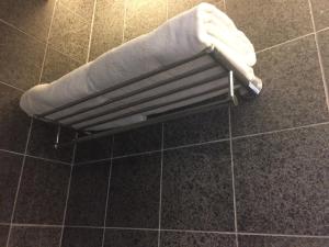 a towel on a towel rack in a bathroom at Twenty One Whitfield in Hong Kong