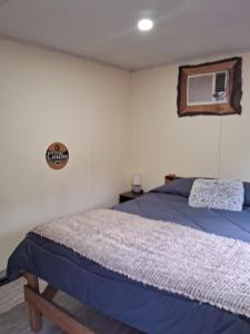 Un pat sau paturi într-o cameră la Granja Lo Zarate