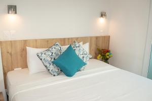 Postel nebo postele na pokoji v ubytování Hotel Caribbean Cartagena