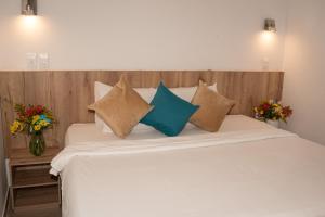 Postel nebo postele na pokoji v ubytování Hotel Caribbean Cartagena