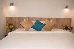 Postel nebo postele na pokoji v ubytování Hotel Caribbean Cartagena