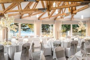 a set up for a wedding in a room with tables and chairs at Langstone Quays Resort, Portsmouth in Portsmouth +85 photos