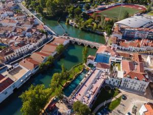 an aerial view of a town next to a river at Vila Gale Collection Tomar in Tomar